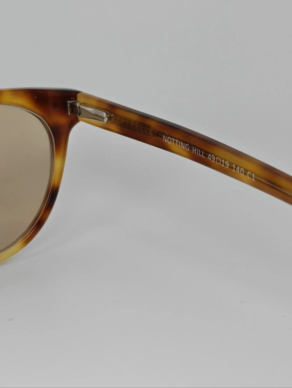 Notting Hill. Feminine. Tortoiseshell Round. Slight Cat Eye Shape.